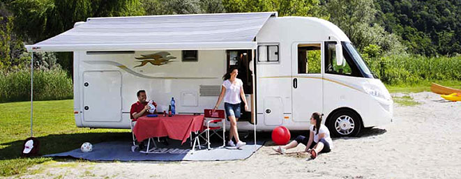 family enjoying a motorhome with awning