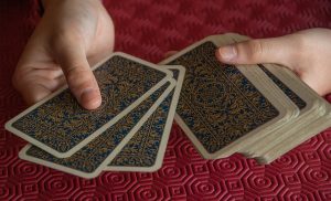 Playing cards being dealt