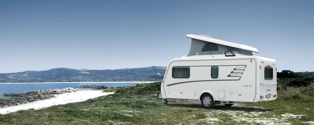 Travelworld caravan parked next to the beach