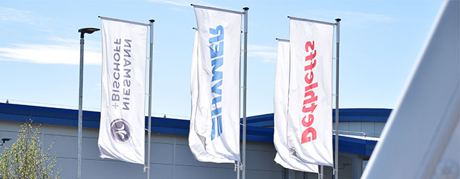 Flags outside Travelworld Showroom