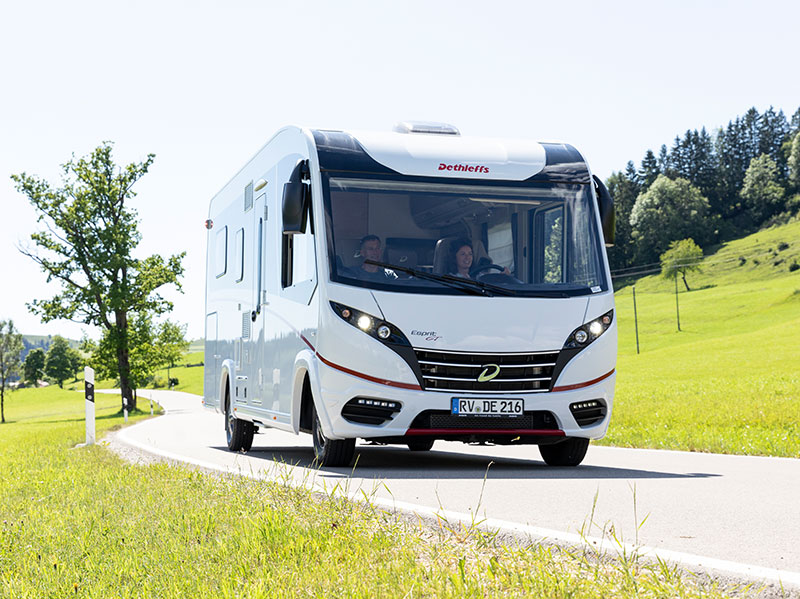 Couple driving Dethleffs Espirit motorhome in the country side