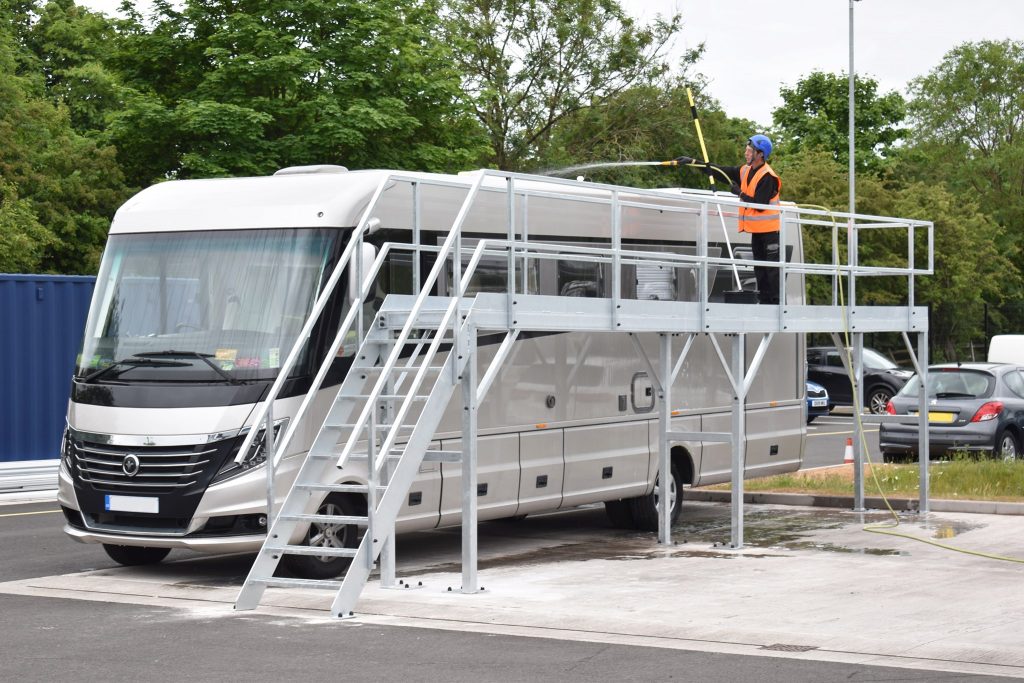 Motorhome being washed from a platform