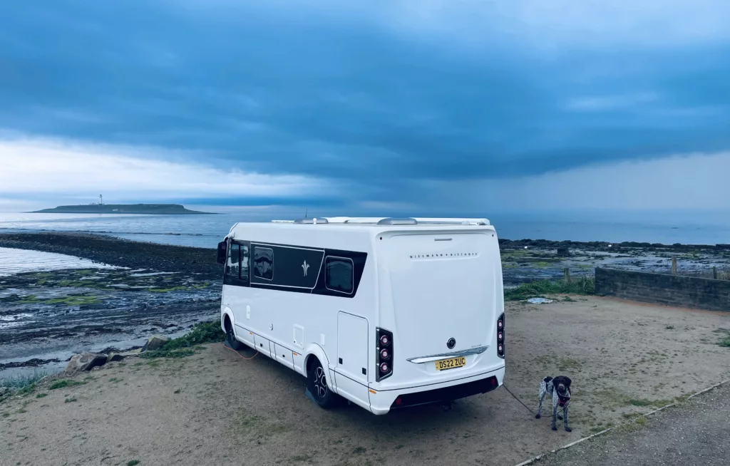 Guy's Niesmann+Bischoff iSmove motorhome next to the sea and blue skies