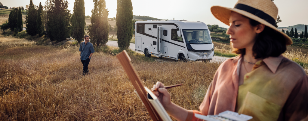 Kreos Motorhome with woman painting in a field