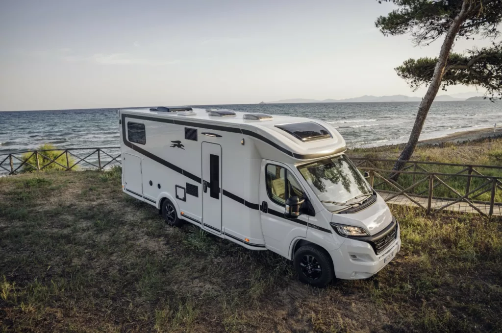 Laika Kosmo Semi-integrated motorhome next to the sea rear angle